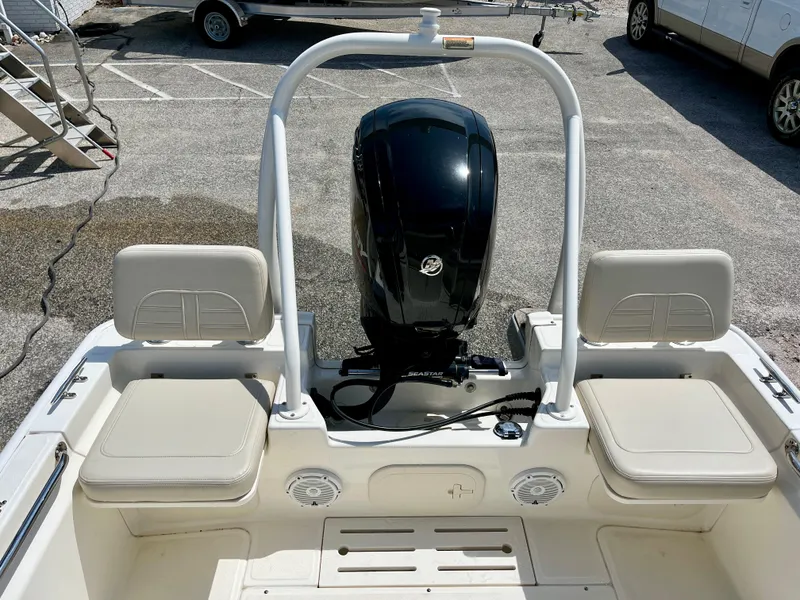 Slide: The Image of 2022 Boston Whaler 17 Montauk boat interior with seating and outboard motor. - 11