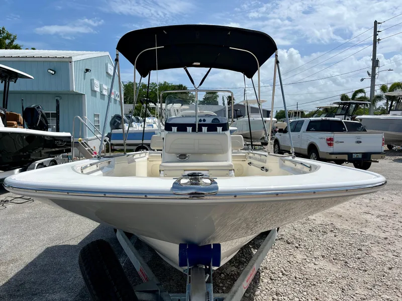 Slide: The Image of 2022 Boston Whaler 17 Montauk boat on trailer, parked outdoors under a clear sky. - 3