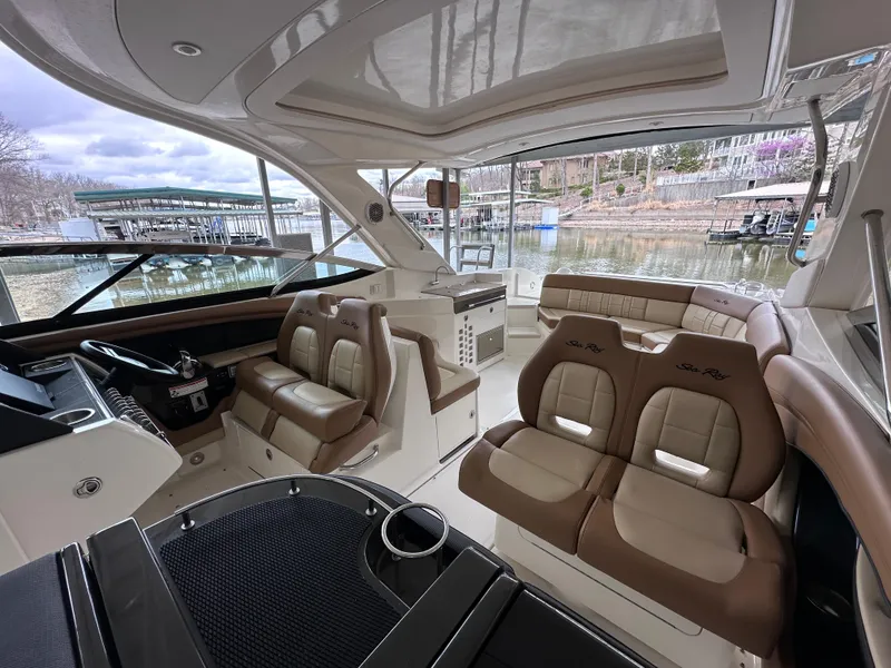 Slide: The Image of Interior of 2014 Sea Ray 350 SLX boat with luxurious seating and helm. - 12