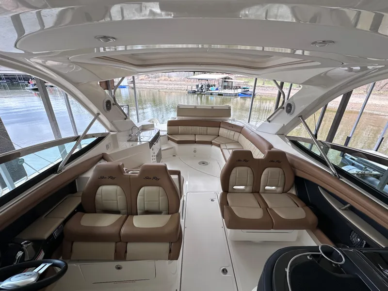 Slide: The Image of 2014 Sea Ray 350 SLX boat interior with luxurious seating and spacious layout. - 13