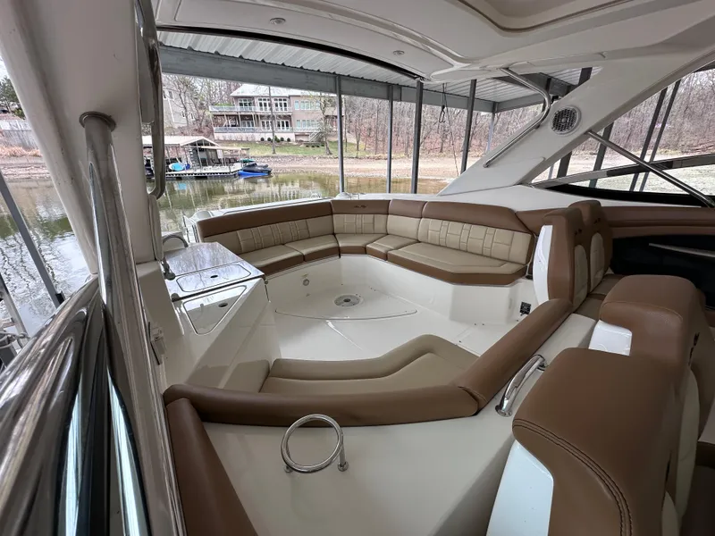 Slide: The Image of 2014 Sea Ray 350 SLX boat interior with spacious seating and elegant design. - 14