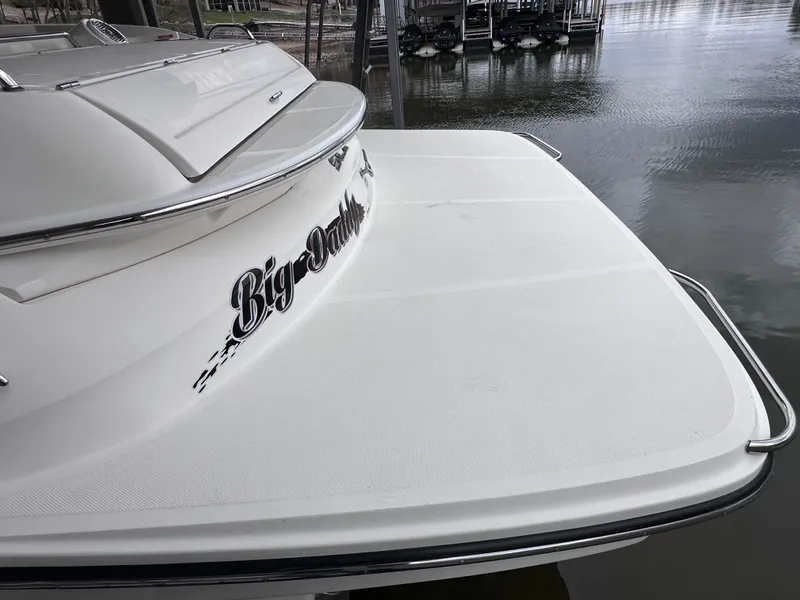 Slide: The Image of 2014 Sea Ray 350 SLX boat with "Big Daddy" name on the stern, docked by the water. - 34
