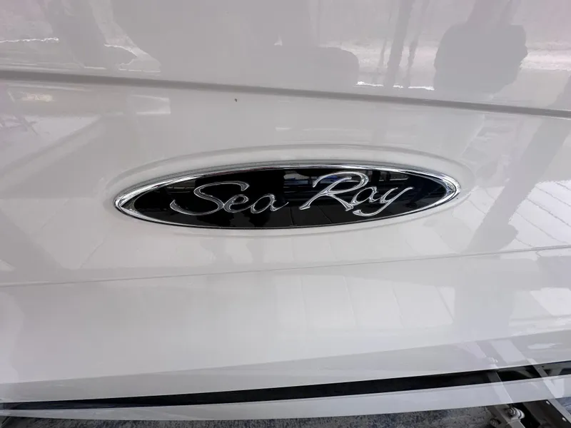Slide: The Image of 2014 Sea Ray 350 SLX logo on white boat exterior. - 35