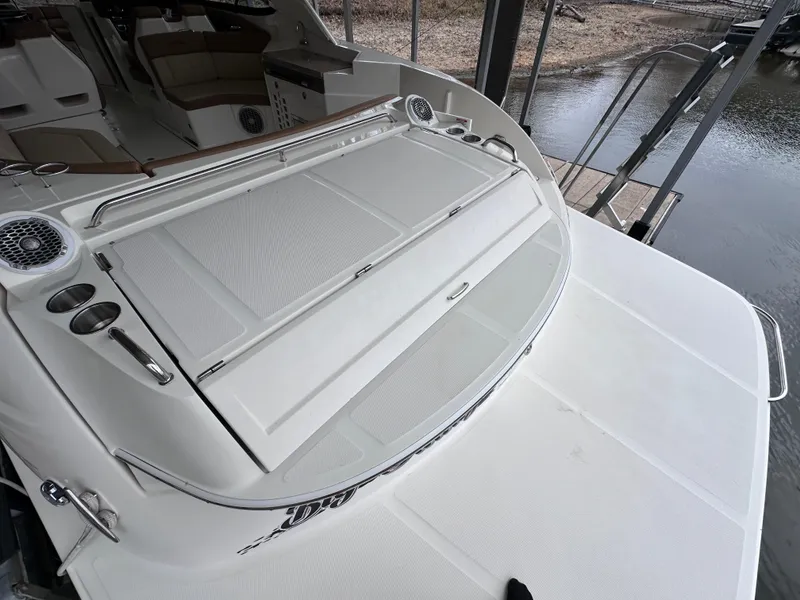 Slide: The Image of 2014 Sea Ray 350 SLX boat with spacious deck and seating area. - 38