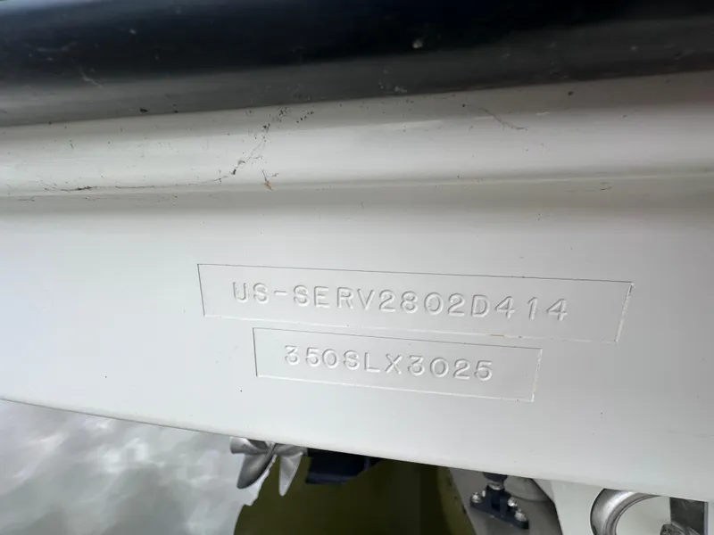Slide: The Image of 2014 Sea Ray 350 SLX boat hull identification number close-up. - 46