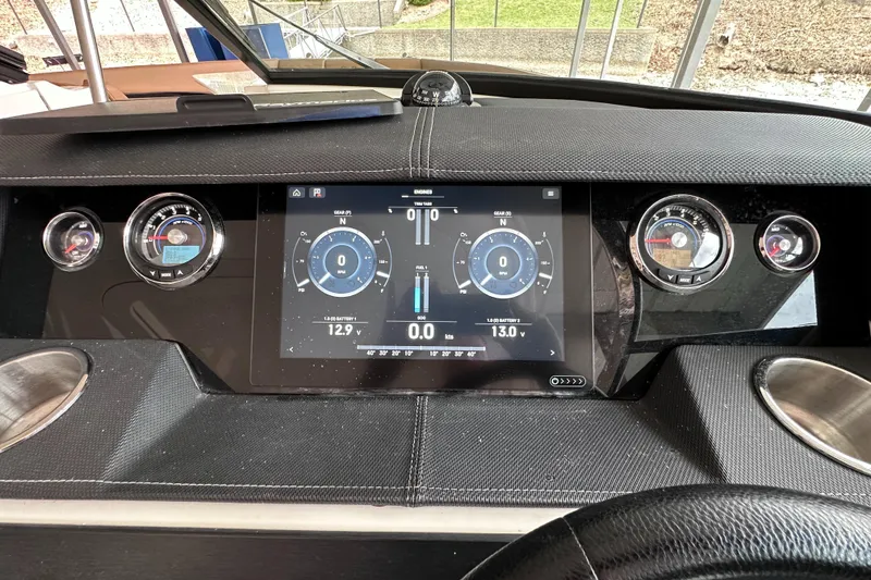 Slide: The Image of Dashboard of a 2014 Sea Ray 350 SLX boat with digital and analog gauges. - 6