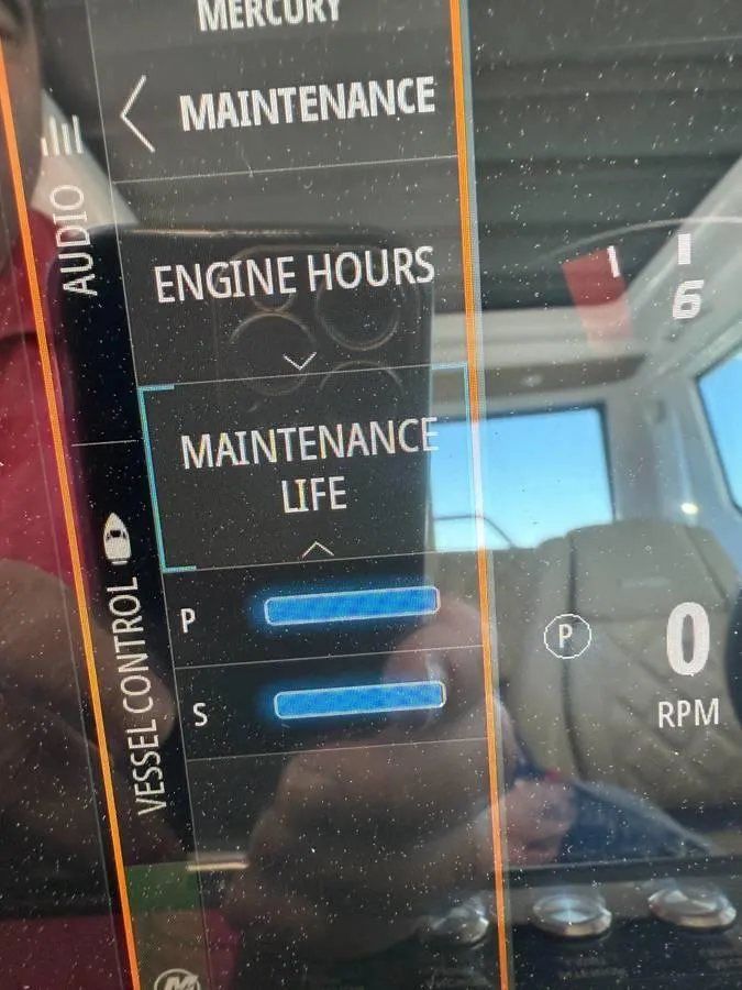 Slide: The Image of Axopar 28 CABIN 2021 dashboard showing engine hours and maintenance status. - 7