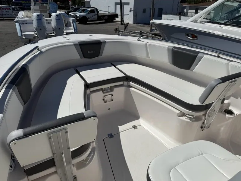 Slide: The Image of 2023 Robalo R250 boat interior with white seating and modern design. - 5