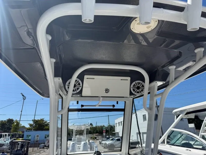 Slide: The Image of 2023 Robalo R250 boat interior with speakers and storage compartment. - 7