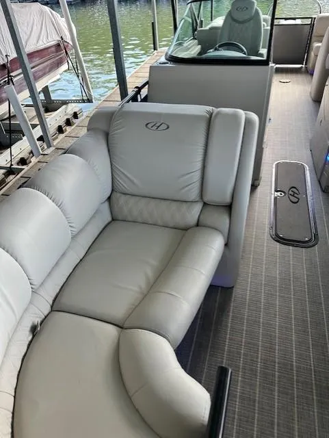 Slide: The Image of 2017 Harris Solstice 250 DC boat interior with plush seating and modern design. - 2