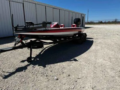 Slide: The Image of 2024 Blazer 650 Pro Tour boat on a trailer in a gravel lot. - 3