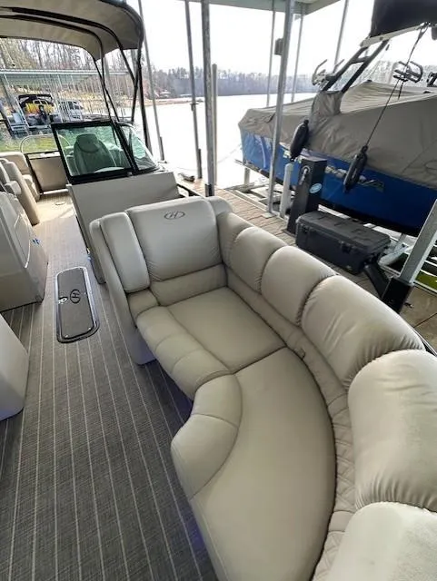 Slide: The Image of 2017 Harris Solstice DC 250 pontoon boat with plush seating and covered dock. - 3