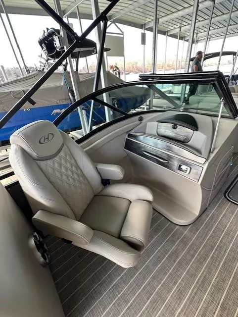 Slide: The Image of 2017 Harris Solstice DC 250 boat interior with luxury seating and modern dashboard. - 8