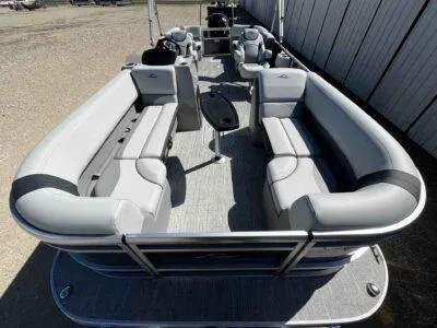 Slide: The Image of 2025 SunCatcher Select 322RC pontoon boat with spacious seating and modern design. - 5