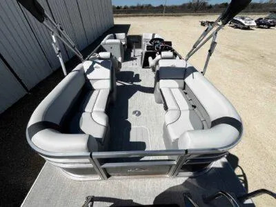 Slide: The Image of 2025 SunCatcher Select 322RC pontoon boat with spacious seating and modern design. - 7