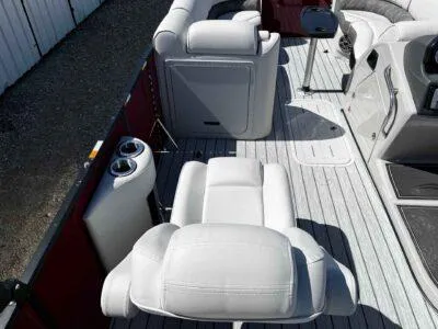 Slide: The Image of Luxurious interior of 2025 SunCatcher Select 322RC pontoon boat with plush seating. - 9