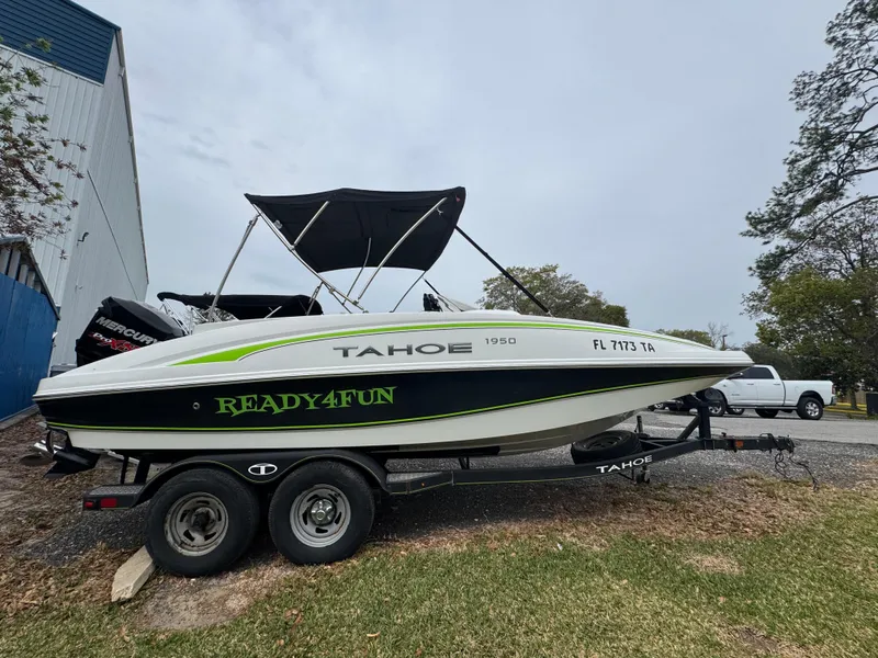 The Image of Tahoe 1950 boat on trailer, "Ready4Fun" decal, parked outdoors, 2018 model. - 0