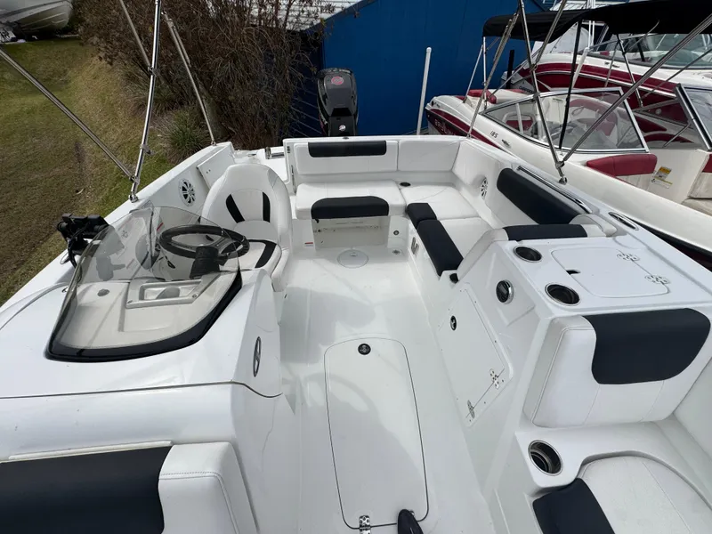 Slide: The Image of White Tahoe 1950 boat interior, 2018 model, featuring seating and steering wheel. - 3