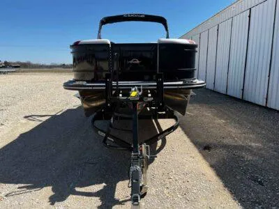 Slide: The Image of 2025 SunCatcher Select 322SS pontoon boat on trailer, parked outdoors. - 19
