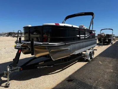 Slide: The Image of 2025 SunCatcher Select 322SS pontoon boat on trailer under clear blue sky. - 20