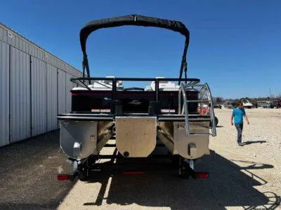 Slide: The Image of 2025 SunCatcher Select 322SS pontoon boat on trailer, parked outdoors. - 4