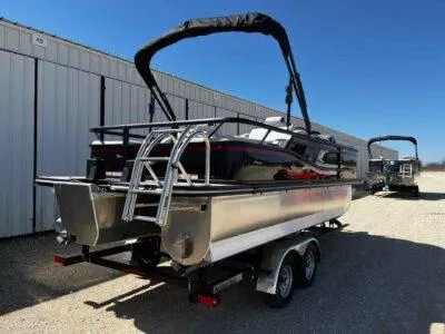 Slide: The Image of 2025 SunCatcher Select 322SS pontoon boat on trailer, parked outdoors. - 5
