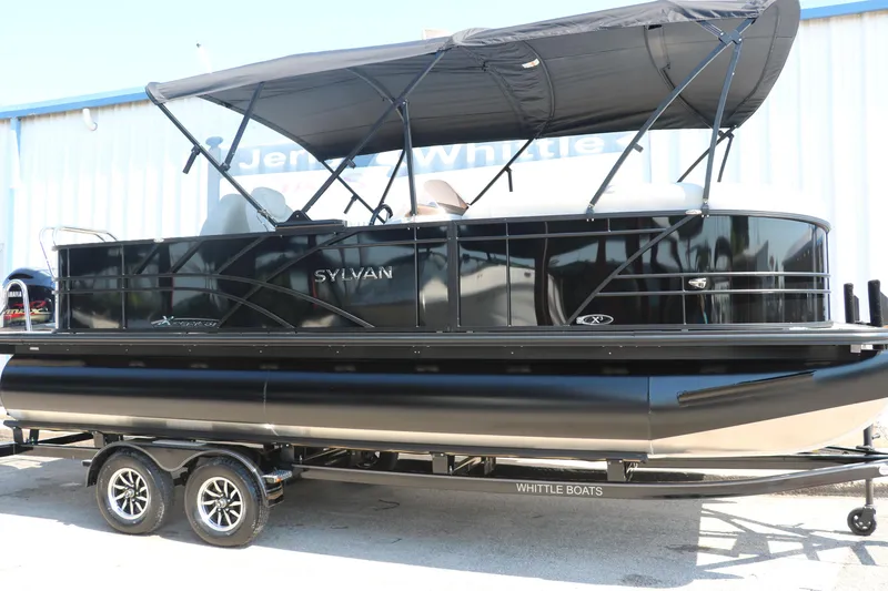 The Image of 2025 Sylvan Mirage X3 Party Fish pontoon boat with canopy on trailer. - 1
