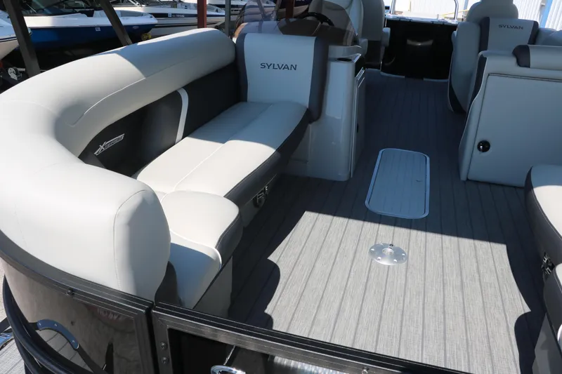 Slide: The Image of 2025 Sylvan Mirage X3 Party Fish pontoon boat interior with spacious seating and modern design. - 19