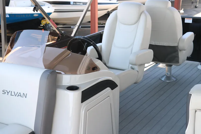 Slide: The Image of 2025 Sylvan Mirage X3 Party Fish boat interior with plush seating and modern design. - 21