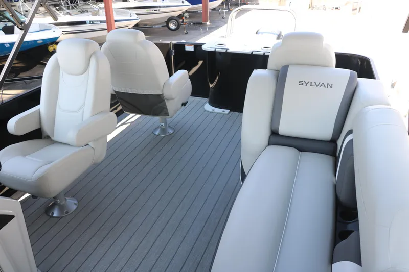 Slide: The Image of 2025 Sylvan Mirage X3 Party Fish boat interior with plush seating and modern design. - 23