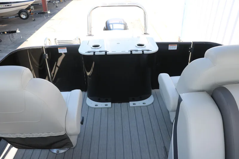 Slide: The Image of 2025 Sylvan Mirage X3 Party Fish boat interior with seating and fishing station. - 25