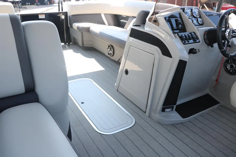 Slide: The Image of 2025 Sylvan Mirage X3 Party Fish interior with modern seating and control panel. - 34