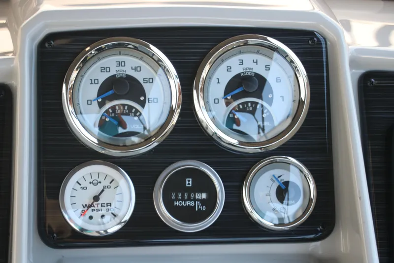 Slide: The Image of Dashboard of 2025 Sylvan Mirage X3 Party Fish with speedometer and gauges. - 38