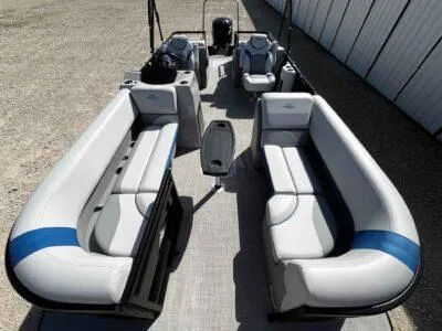 Slide: The Image of 2025 SunCatcher Select 322SS pontoon boat with spacious seating and modern design. - 10