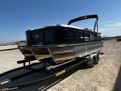Slide: The Image of 2025 SunCatcher Select 322SS pontoon boat on trailer, parked outdoors under clear sky. - 3
