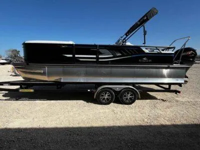 Slide: The Image of 2025 SunCatcher Select 322SS pontoon boat on trailer, side view, outdoors. - 4
