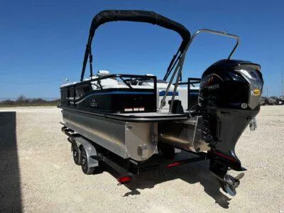 Slide: The Image of 2025 SunCatcher Select 322SS pontoon boat with outboard motor on a trailer. - 5