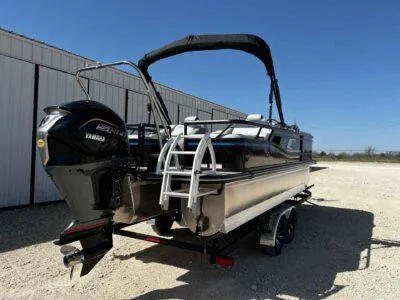 Slide: The Image of 2025 SunCatcher Select 322SS pontoon boat with Yamaha motor, parked outdoors. - 7