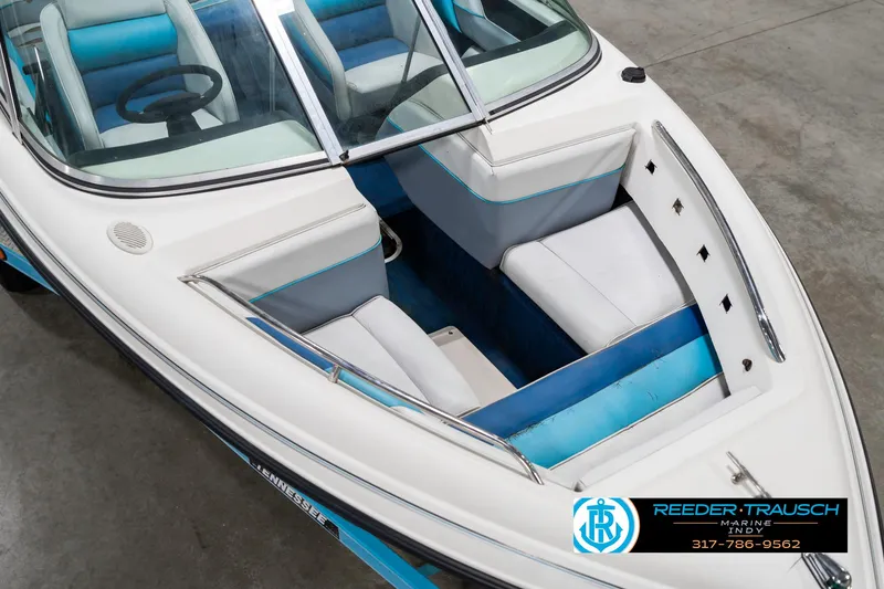 Slide: The Image of 1991 Chaparral 1800 SL boat interior with blue and white seating, viewed from above. - 12