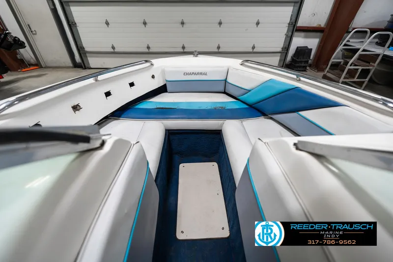 Slide: The Image of Interior of a 1991 Chaparral 1800 SL boat with blue and white seating. - 20