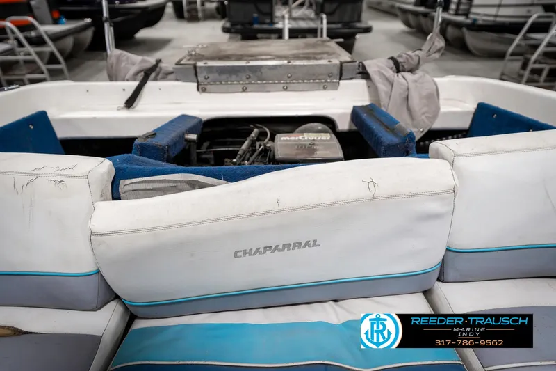 Slide: The Image of 1991 Chaparral 1800 SL boat interior with visible engine and seating. - 24