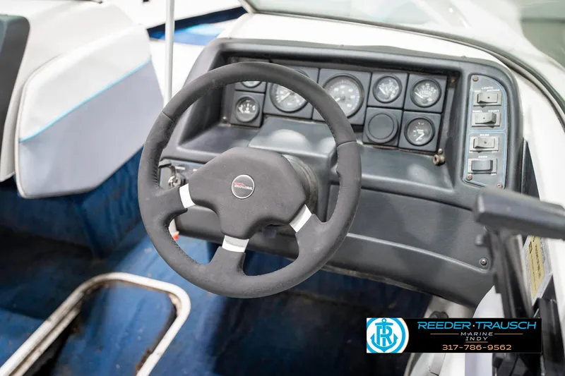 Slide: The Image of 1991 Chaparral 1800 SL boat dashboard with steering wheel and instrument panel. - 26