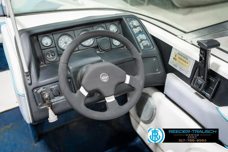 Slide: The Image of 1991 Chaparral 1800 SL boat dashboard with steering wheel and control panel. - 27