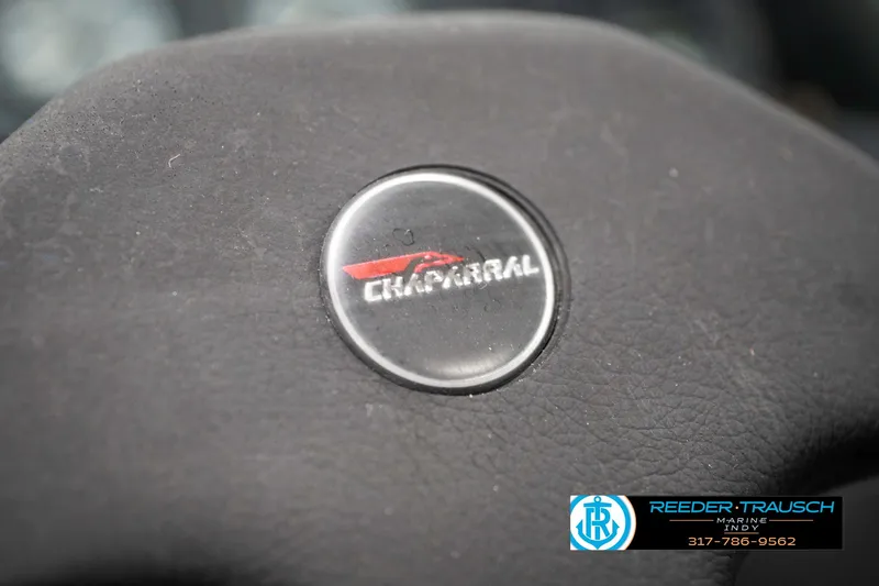 Slide: The Image of Chaparral 1800 SL 1991 steering wheel emblem with logo and text. - 28