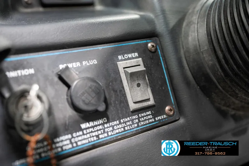 Slide: The Image of Control panel of a 1991 Chaparral 1800 SL boat with power plug and blower switch. - 29