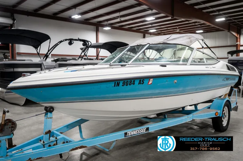 Slide: The Image of 1991 Chaparral 1800 SL boat on trailer in indoor showroom. - 3