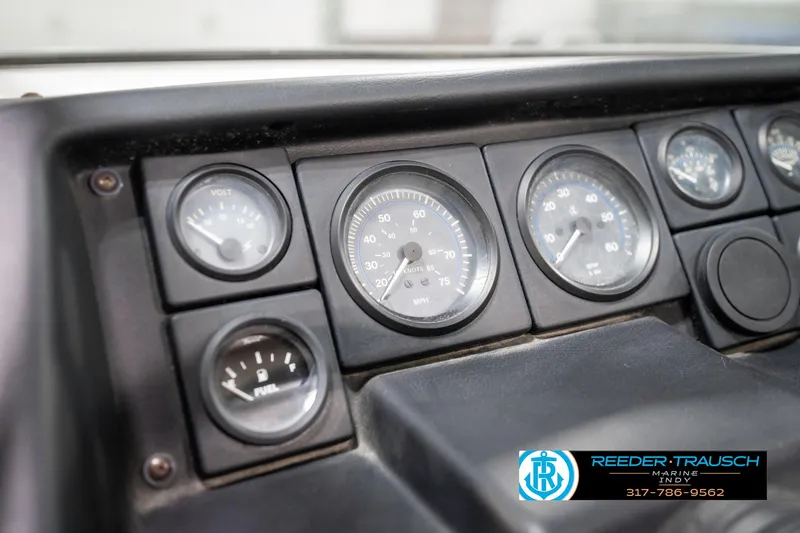 Slide: The Image of Dashboard of a 1991 Chaparral 1800 SL boat with gauges and controls. - 30