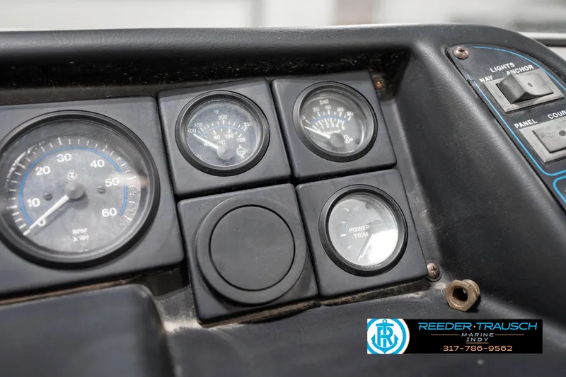 Slide: The Image of 1991 Chaparral 1800 SL dashboard with gauges and controls, featuring speedometer and power indicators. - 31