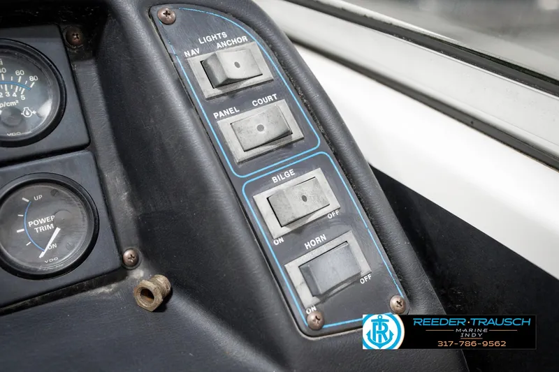 Slide: The Image of Control panel of a 1991 Chaparral 1800 SL boat with switches and gauges. - 32