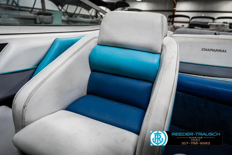 Slide: The Image of 1991 Chaparral 1800 SL boat interior with blue and white seating. - 33